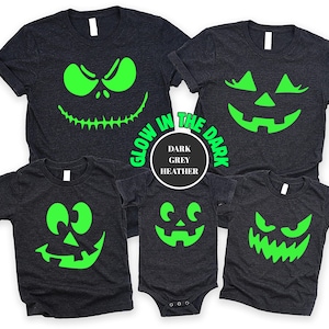 glow pumpkin shirt, halloween matching, jack o lantern face, spooky family shirt, glow in dark tee, halloween tee set, family costume tee, matching pumpkin top, dark grey tee set, halloween graphic, trick or treat outfit, pumpkin glow shirt, halloween night top
