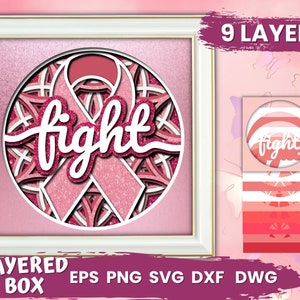 May include: A pink and white layered papercraft design of a pink ribbon with the word "fight" in white lettering. The design is in a circle and has a white frame. The image also shows the 9 layers of the design.