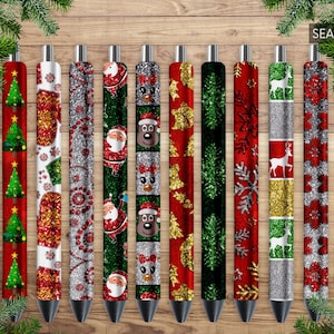 May include: Twelve silver pens with different Christmas-themed designs. The pens have red, green, silver, and gold glitter accents. The designs include snowflakes, reindeer, Christmas trees, and Santa Claus.