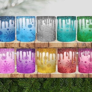 May include: Ten ceramic mugs with a snowflake design and glitter accents. The mugs are in various colors, including blue, green, purple, pink, and gold.