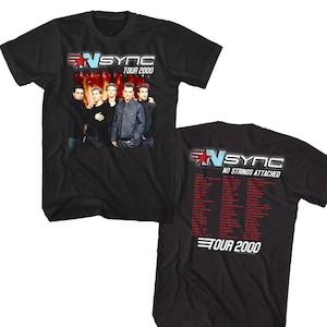 May include: Black t-shirt with a red star and the text "NSYNC TOUR 2000" on the front. The back of the shirt has the text "NSYNC NO STRINGS ATTACHED TOUR 2000" and a list of cities.