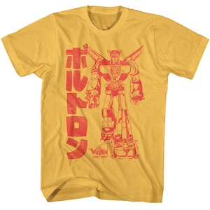 May include: A yellow t-shirt with a red graphic of a robot with the text "Voltron" and Japanese characters.