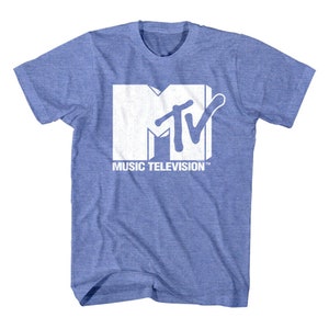 May include: A light blue t-shirt featuring the MTV logo in white. The logo includes the letters "MTV" with the words "MUSIC TELEVISION" printed below. The shirt is made of a soft, comfortable material.
