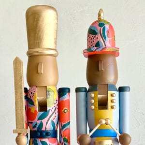 Handpainted Red Floral Nutcracker Set with Melanated Features – Wooden Christmas Mantel Decor (2 Pieces)