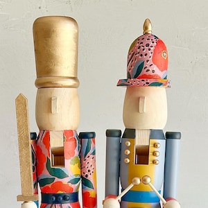 Handpainted Red Floral Nutcracker Set – Wooden Christmas Mantel Decor (2 Pieces)