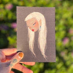 May include: A black and white illustration of a person with long white hair and a blue earring. The illustration is drawn on a black background.