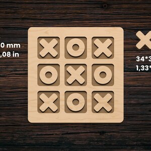 May include: A wooden tic-tac-toe game set. The game board is square, measuring 180 x 180 mm, with carved spaces for X's and O's. Two individual game pieces are included, each 34 x 34 mm. The text "Sizes: 180*180 mm, 7,08*7,08 in, 34*34 mm, 1,33*1,33 in" is visible.