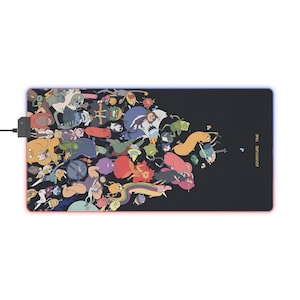May include: A black mouse mat featuring a colourful illustration of characters from the animated television series Adventure Time. The text "Adventure Time" is printed in gold on the right side of the mouse mat.