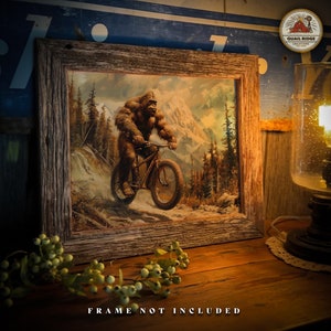 May include: A framed print of a Bigfoot riding a bicycle through a snowy mountain landscape. The print is in a rustic wooden frame. "FRAME NOT INCLUDED" is written below the image.
