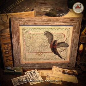 May include: A vintage map of Pennsylvania with a pheasant in flight over the state. The map is in a rustic wooden frame. The text "PENNSYLVANIA" is visible on the map. The text "FRAME NOT INCLUDED" is visible at the bottom of the image.