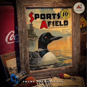 May include: A vintage magazine cover featuring a loon swimming in a lake with the title "Sports Afield and Trails of the Northwoods" in bold red and black lettering. The magazine cover is dated September 1934 and has a price of 10 cents.