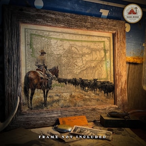 May include: A vintage map of Montana with a cowboy riding a brown horse in the foreground. The map is framed in a rustic wooden frame. The text "Bee Line Route" is visible in the lower right corner of the image.