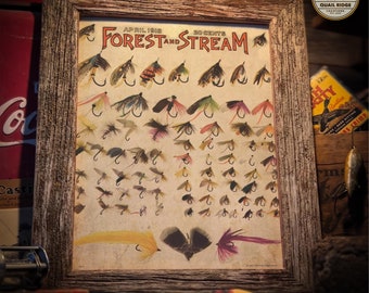 May include: A vintage print of a Forest and Stream magazine cover from April 1918, featuring a collection of 20 different fly fishing lures. The print is framed in a rustic wooden frame.