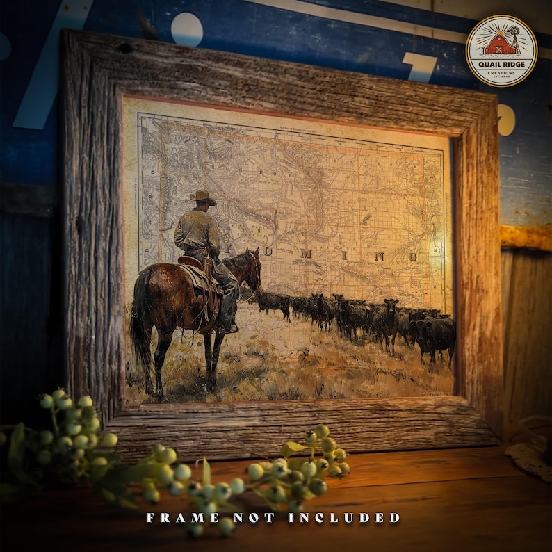 May include: A vintage-style print of a cowboy riding a horse through a field of cattle. The print features a map of Minnesota in the background. The print is framed in a rustic wooden frame.