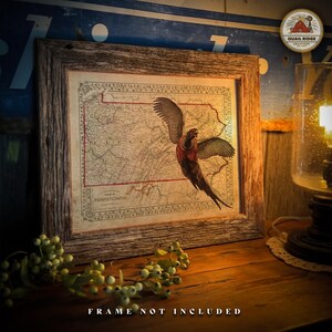 May include: A vintage map of Pennsylvania with a pheasant flying over it. The map is framed in a rustic wooden frame. The image is labeled "Quail Ridge Creations".