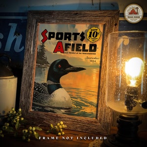 May include: A vintage magazine cover featuring a loon swimming in a lake at sunset. The magazine is titled "Sports Afield" and the cover date is September 1934. The text "Now 10&cent; in Canada 15&cent;" is also visible on the cover.