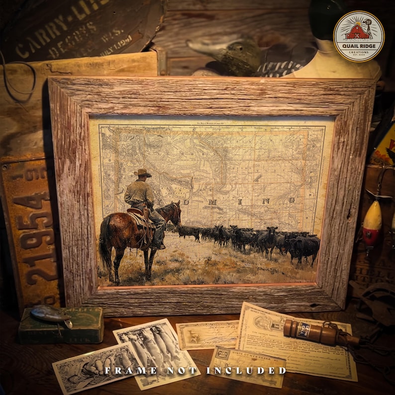 May include: A vintage-style print of a cowboy riding a horse with a herd of cattle in the background. The print is framed in a rustic wooden frame. The print features a map of the state of Minnesota with the word "MINNESOTA" printed on the map.
