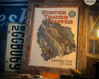 May include: A vintage magazine cover for Hunter Trader Trapper, featuring a raccoon climbing a tree. The cover is dated September 1932 and costs 25 cents. The magazine cover is framed in a rustic wooden frame.
