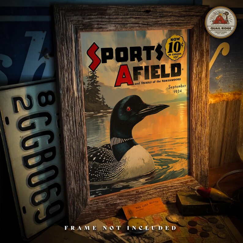 May include: A vintage framed print of a magazine cover for "Sports Afield" featuring a loon swimming in a lake. The cover is from September 1934 and has the text "Now 10c in Canada 15c".