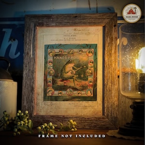 May include: A vintage advertisement for Hanes Frog Flds and Twist Chewing and Smoking Tobacco. The advertisement features a cartoon frog sitting on a mushroom, holding a pipe and surrounded by other frogs. The text "Hanes Frog" is printed in large letters at the top of the advertisement.