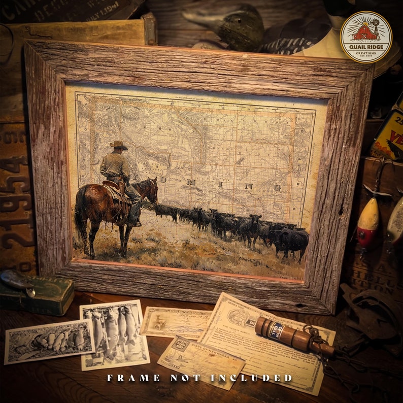 May include: A vintage-style print of a cowboy riding a horse with a herd of cattle in the background. The print is framed in a rustic wooden frame. The print features a map of the state of Minnesota.