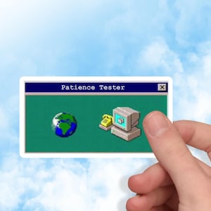 May include: A sticker featuring a retro computer interface with the text "Patience Tester." The design includes a globe, a telephone, and a vintage computer monitor. The sticker is held against a blue sky background.