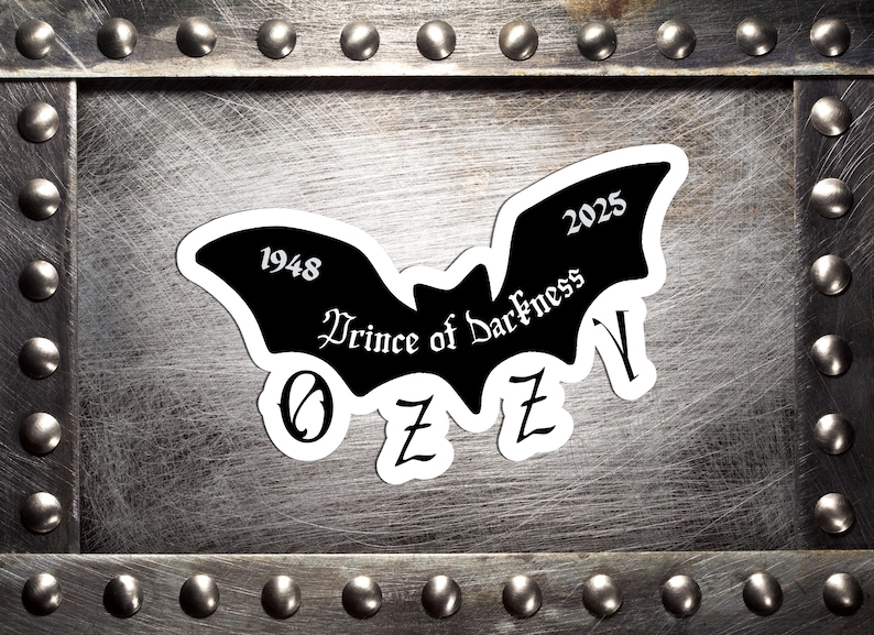 May include: A black bat-shaped sticker with the text "Prince of Darkness" and the name "OZZY" in a gothic font. The sticker also includes the years "1948" and "2025". The sticker is set against a textured, metallic background.