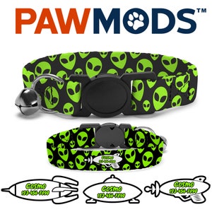May include: A black and green cat collar with a green alien face pattern. The collar has a black buckle and a silver bell. The collar is shown with a matching breakaway cat collar and three personalized cat ID tags with a rocket ship, UFO, and rocket ship design.