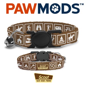 May include: Brown cat collar with a white background and a pattern of camping icons. The collar has a black buckle and a silver bell. The collar is accompanied by a matching brown and white ID tag with the text "Scout 123-456-7890".