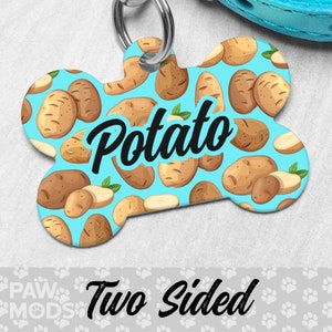 May include: A blue bone-shaped dog tag with a white potato pattern and the word "Potato" in black cursive lettering. The tag is two-sided.