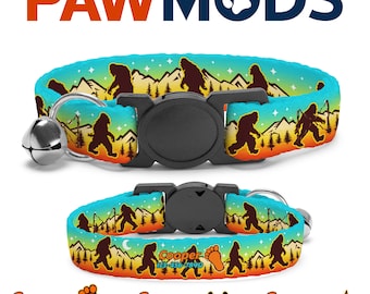 May include: A blue and orange cat collar featuring a Bigfoot graphic in a forest setting. The collar has a bell and a black buckle. The text "Cooper 123-456-7890" is printed on the collar.