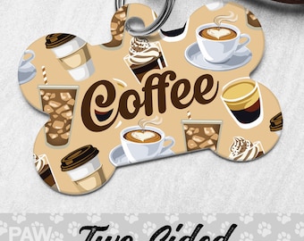 May include: A bone-shaped dog tag with a beige background and a repeating pattern of coffee cups and iced coffee drinks. The text "Coffee" is written in brown cursive letters on the tag.