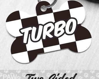 May include: Black and white checkered bone-shaped dog tag with the word "TURBO" in white letters. The tag is two-sided.