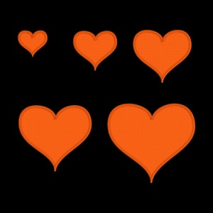 May include: Five orange felt hearts of different sizes on a black background.