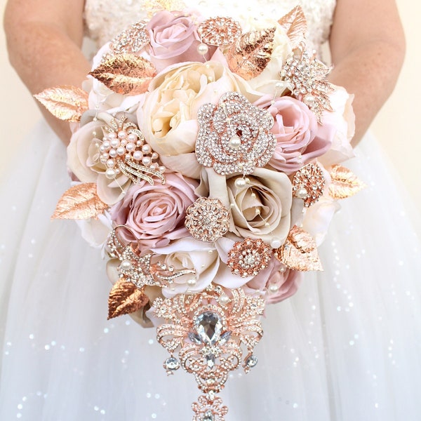 Blush pink rose gold wedding bouquet. Dusty rose cascading brooch bouquet. Pink ivory bridal bouquet by Weddiology