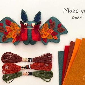 Handmade felt bat plushie made from a DIY sewing pattern, perfect for Halloween decor or spooky gifts.
