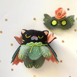 Stuffed halloween cat plush toy, handcrafted from felt, ideal for gothic, witchy, or spooky home decor.