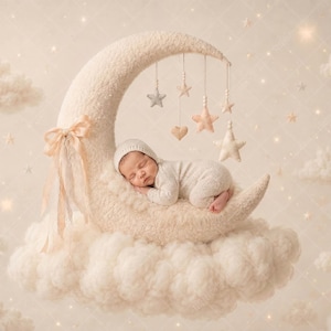 May include: A plush, cream-colored crescent moon prop featuring a soft, fuzzy texture, adorned with a light peach ribbon bow and hanging fabric stars and hearts. A sleeping infant wearing a matching knit bonnet and onesie rests on the moon.