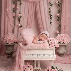 May include: A newborn baby in a pink tutu and bonnet lies on a white piano, surrounded by pink roses and draped fabric. The scene is set in a studio with a soft, romantic aesthetic, perfect for newborn photography.