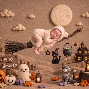 May include: A felted wool scene featuring a sleeping infant in a beige bonnet and onesie resting on a broomstick. Hanging ornaments include a black cat in a purple hat, a cauldron, and a star. Below are felted pumpkins, a ghost, a cat, and lanterns.