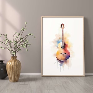 以下が含まれることがあります： カラフルな背景に描かれたアコースティックギターの水彩画。ギターは薄い木目調の茶色で、薄い茶色のピックガードが付いています。背景は、青、紫、オレンジの水彩のぼかしで構成されています。