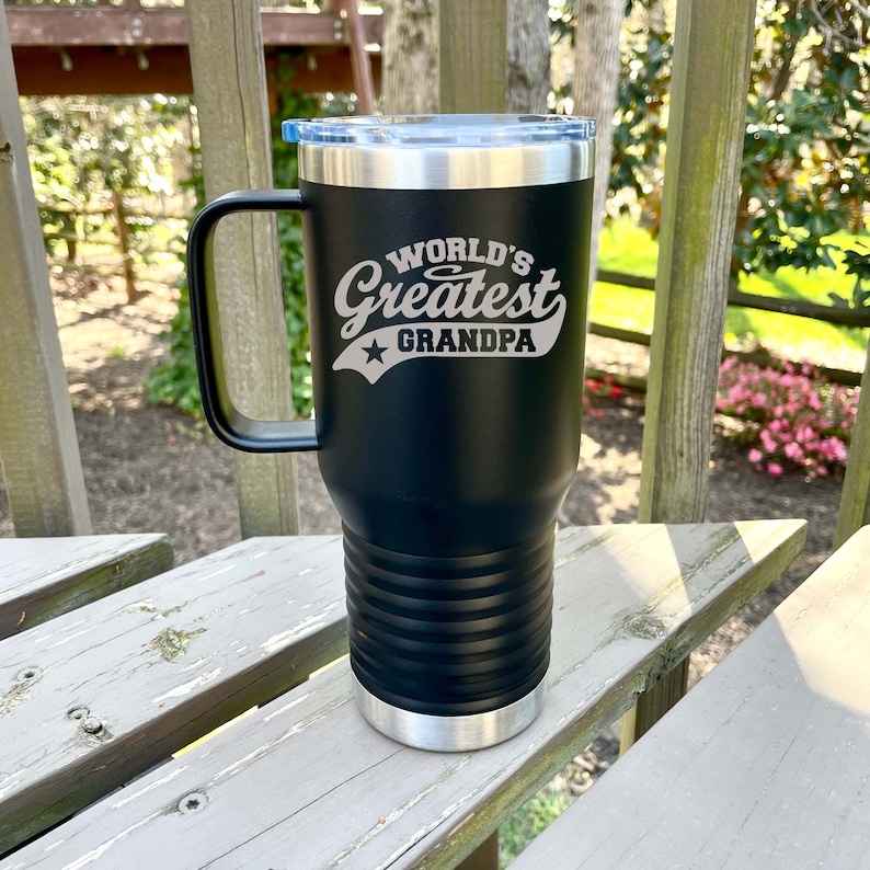a black and silver mug with a graphic that says World’s Greatest Grandpa.