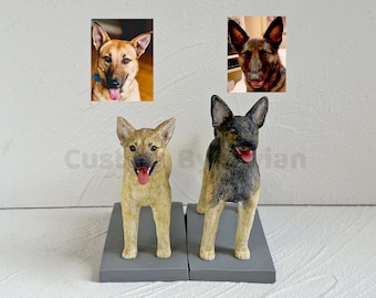 May include: Two custom dog figurines, one brown and one gray, standing on gray bases. The figurines are posed in a standing position with their tongues sticking out.