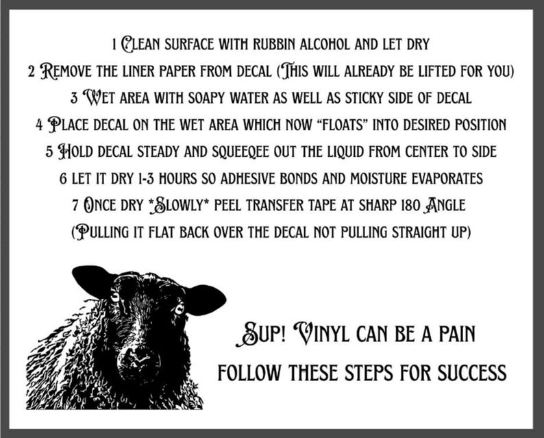 May include: A white instructional sign with black text and a black sheep illustration. The text reads: 1 CLEAN SURFACE WITH RUBBIN ALCOHOL AND LET DRY, 2 REMOVE THE LINER PAPER FROM DECAL, 3 WET AREA WITH SOAPY WATER, 4 PLACE DECAL, 5 SQUEEGEE, 6 DRY, 7 PEEL.