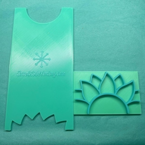 May include: Two-piece set of turquoise 3D-printed tools. One is a tall, notched shape with a snowflake design and the text "Chaotic3DPrinting.com." The other is a rectangular stamp with a sunflower design.