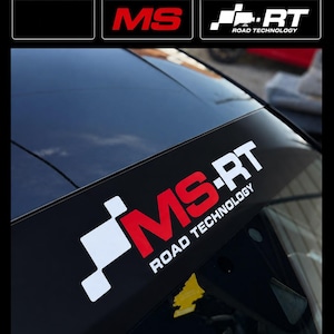 May include: A black windshield banner decal featuring the white and red MS-RT logo and the text ROAD TECHNOLOGY. The design includes a checkered flag graphic element. The top section displays color options for the background, the MS letters, and the logo.