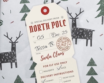 May include: A red and white gift tag with a North Pole theme. The tag has a red circle with a white dot in the center, and the text "SPECIAL DELIVERY FROM NORTH POLE". The tag also has a red and white striped border. The tag is labeled with the date "Dec. 25", the number "05", and the name "Tessa B.". The tag also has the text "FROM Santa Claus". The tag has a section for "FOR ELF USE ONLY" with checkboxes for "NAUGHTY" and "NICE". The tag also has a section for "DELIVERY INSTRUCTIONS" with checkboxes for "CHIMNEY", "WINDOW", "FRONT DOOR", and "GARAGE".