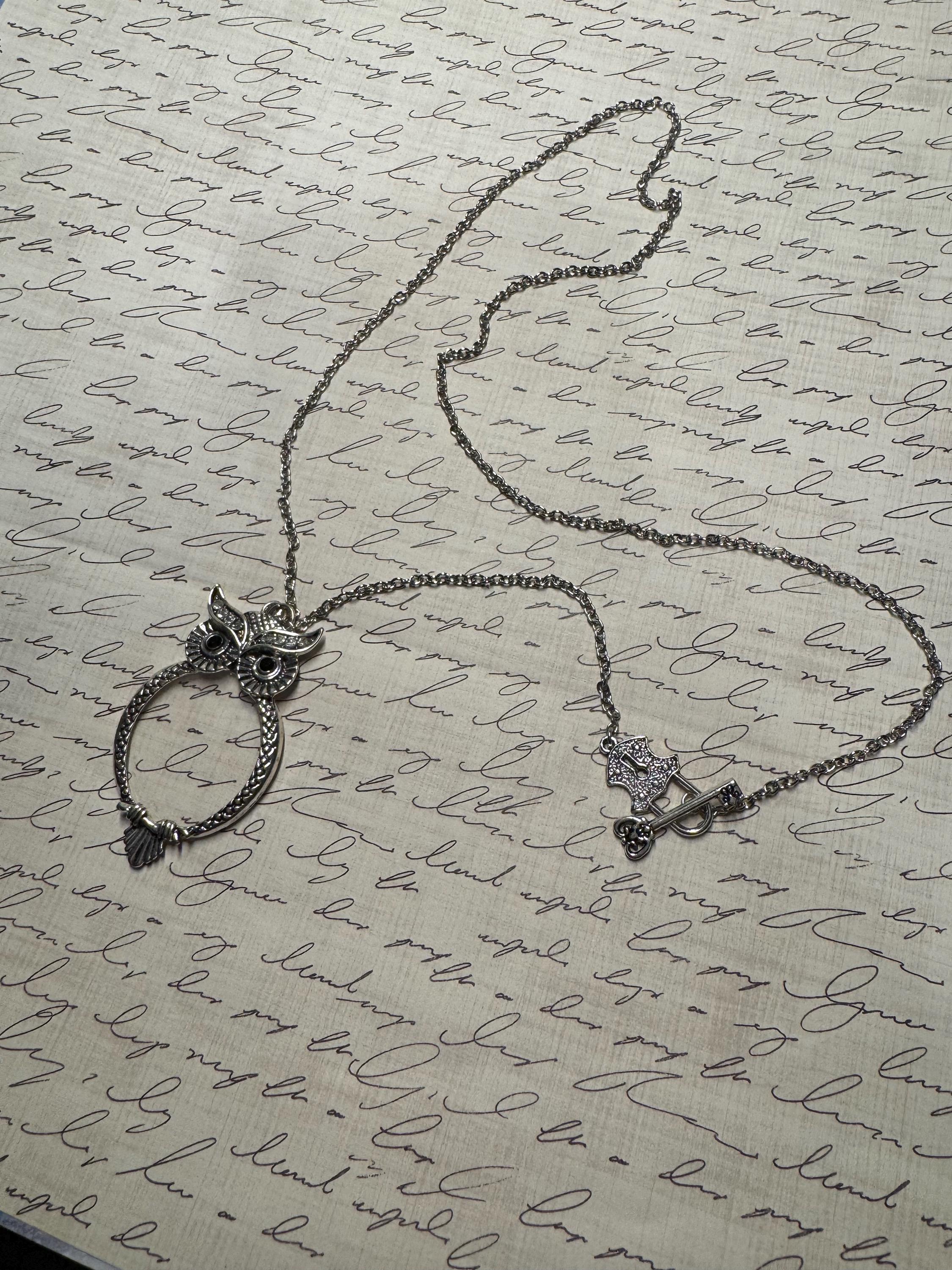 Magnifying glass owl pendant