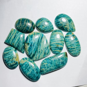 May include: Assortment of ten green and blue amazonite cabochons with a striated pattern. The cabochons are various shapes and sizes.