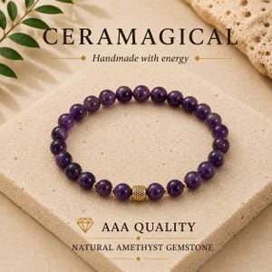 May include: A beaded bracelet featuring round, deep purple amethyst gemstones and a single textured gold-tone metal bead. The text CERAMAGICAL, Handmade with energy, AAA QUALITY, and NATURAL AMETHYST GEMSTONE is visible in the image.